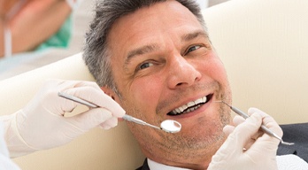 Smiling man in the dental chair 