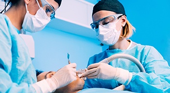 Dentists performing surgery