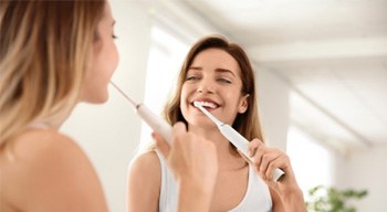 Woman brushing her teeth