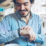 man checking watch for time