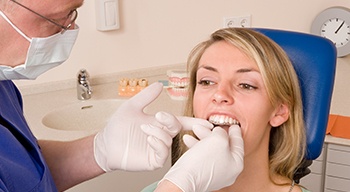 Dentist placing clear aligner tray