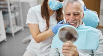 man smiling during dental checkup 