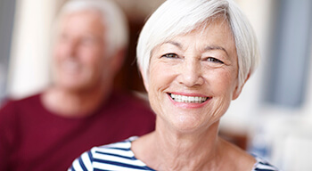 woman in striped shirt smiling