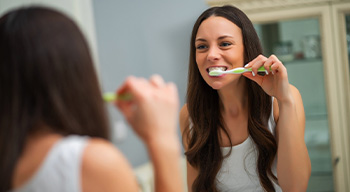 Dentist explaining benefits of dental implants in Somerville to patient