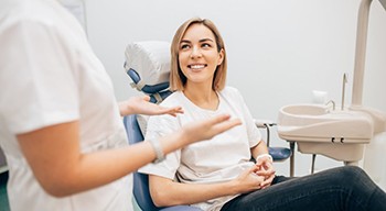 woman talking to her dentist 