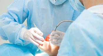 Implant dentist in Somerville performing treatment on a patient