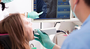 dentist using intraoral camera