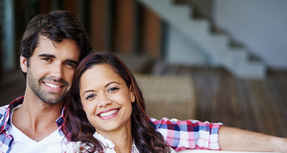 man and woman sitting on couch together