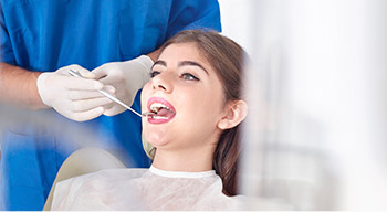 dentist doing an oral cancer screening