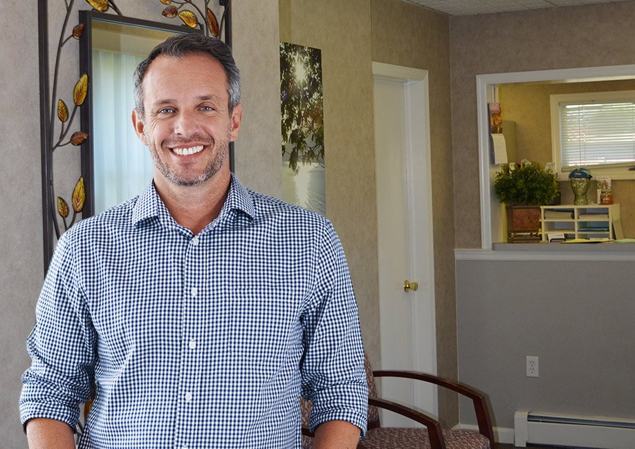 man in striped shirt smiling