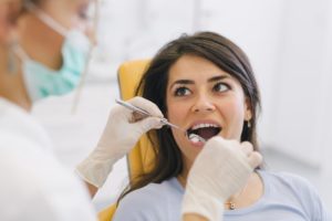 A woman having her first dental checkup.